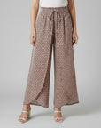 Beige printed wide-leg trousers with elastic waistband and gathered tie waist
