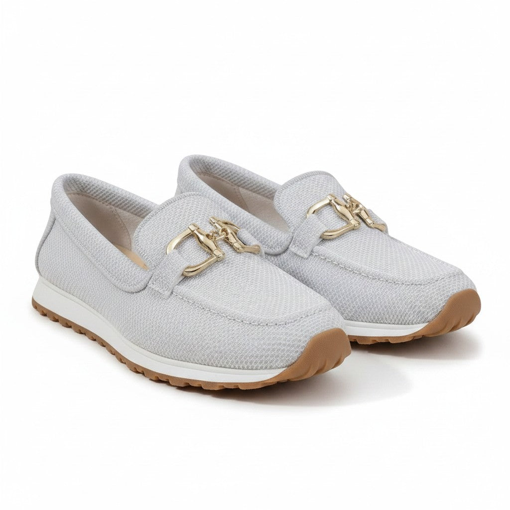 Light gray slip-on loafers with gold bit accents and textured fabric upper.