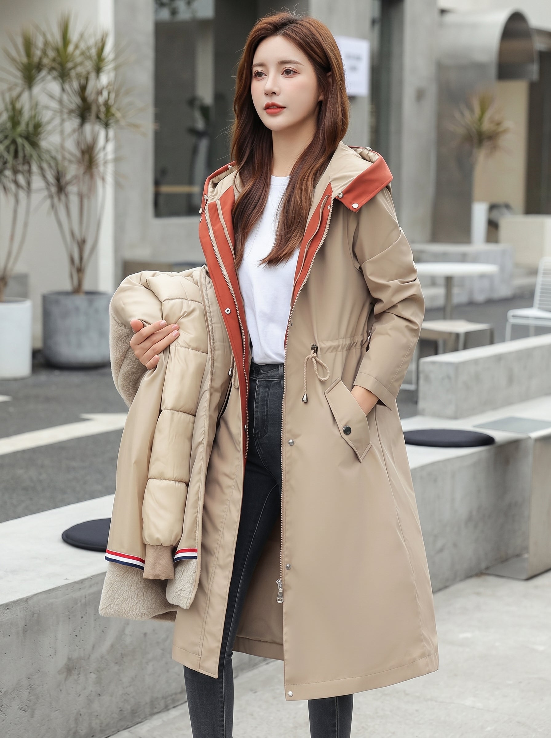 Beige waterproof hooded jacket with faux fur trim, drawstring waist, button front